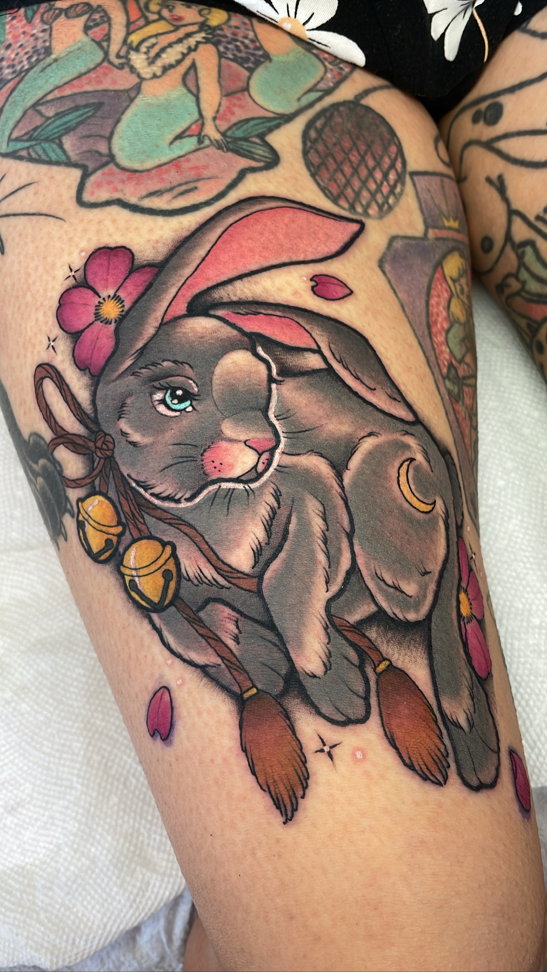 Rabbit with bells and pink flowers, neo traditional tattoo by Mariella